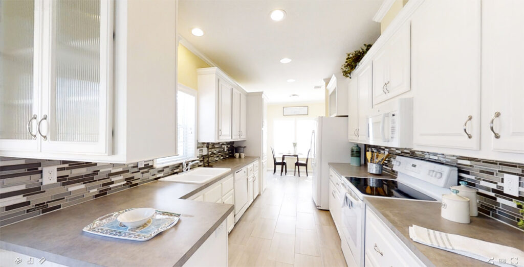Galley Kitchen with White Cabinets