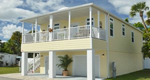 Home on stilts at Ocean Breeze with garage below