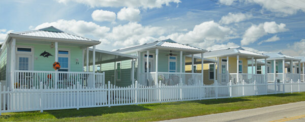 street lined homes with picket fence