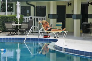 Women sunning by pool